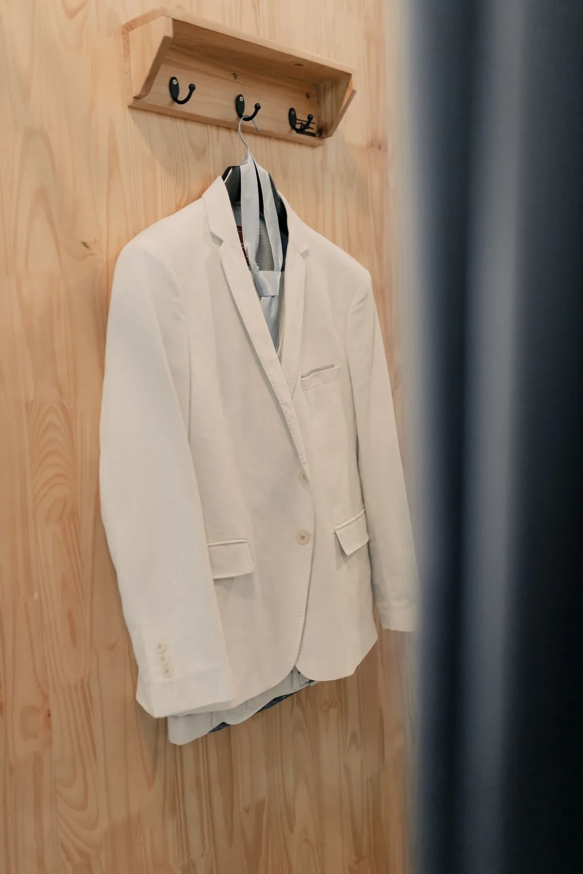 Professional dry cleaning and pressing of a suit at Cardiff Perfections Launderette, restoring jacket shape and a sharp trouser crease